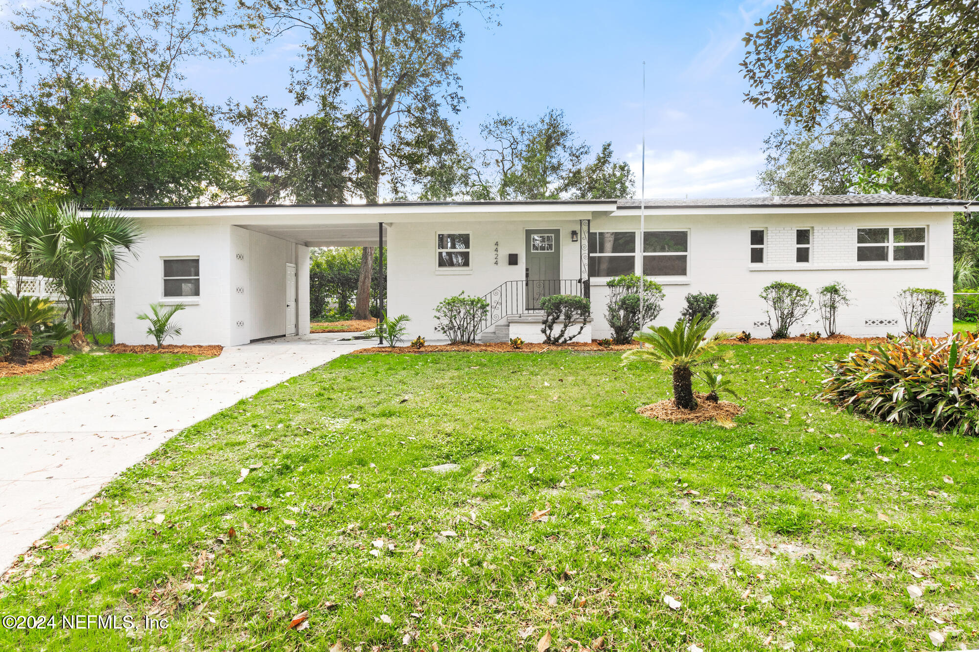 front view of a house with a yard