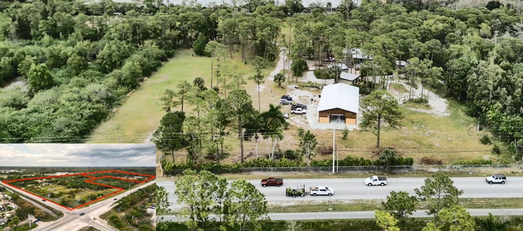 an aerial view of a house with a yard and lake view