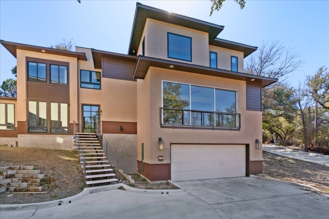 a front view of a house with garage