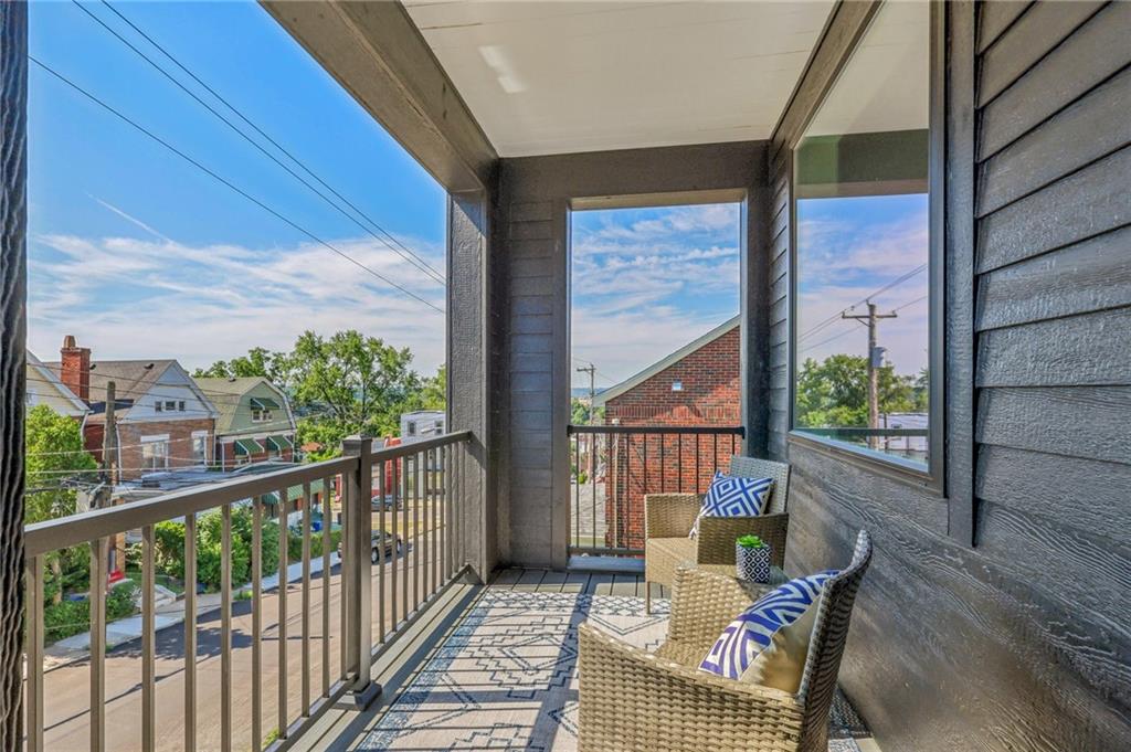 a view of balcony with furniture