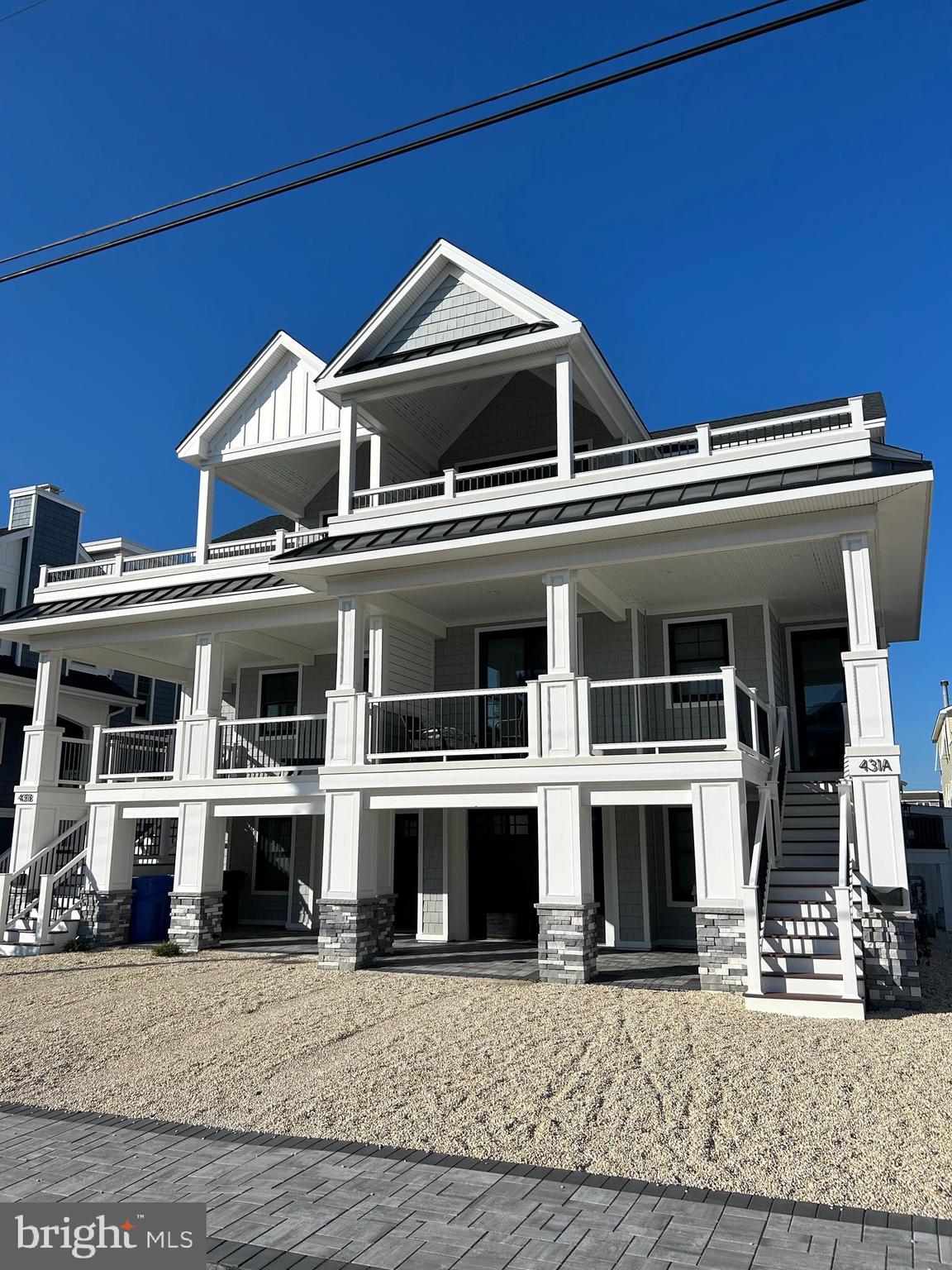 a front view of a house with large windows