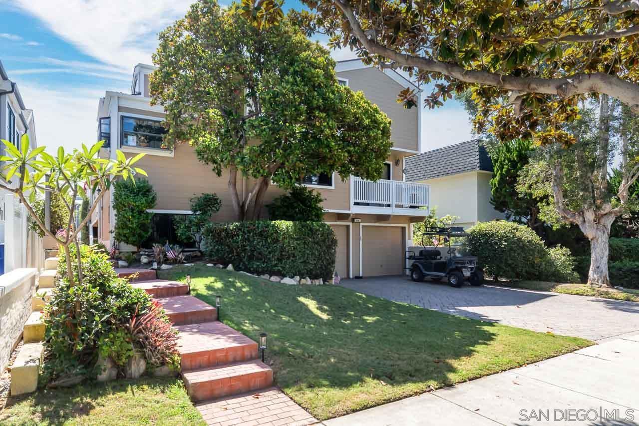 a view of backyard of house with green space