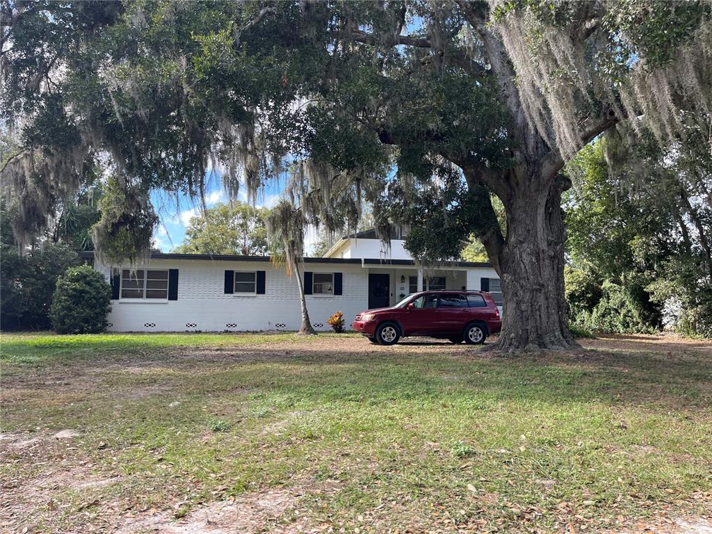 a view of a house with a yard