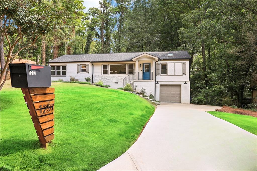 a front view of a house with yard