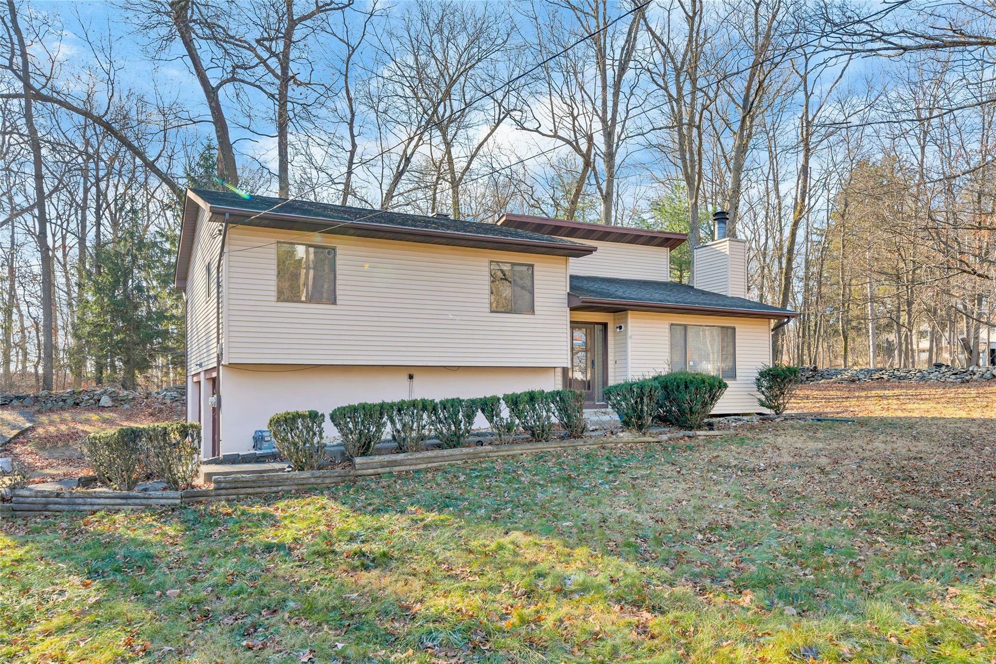 View of front of house with a front yard