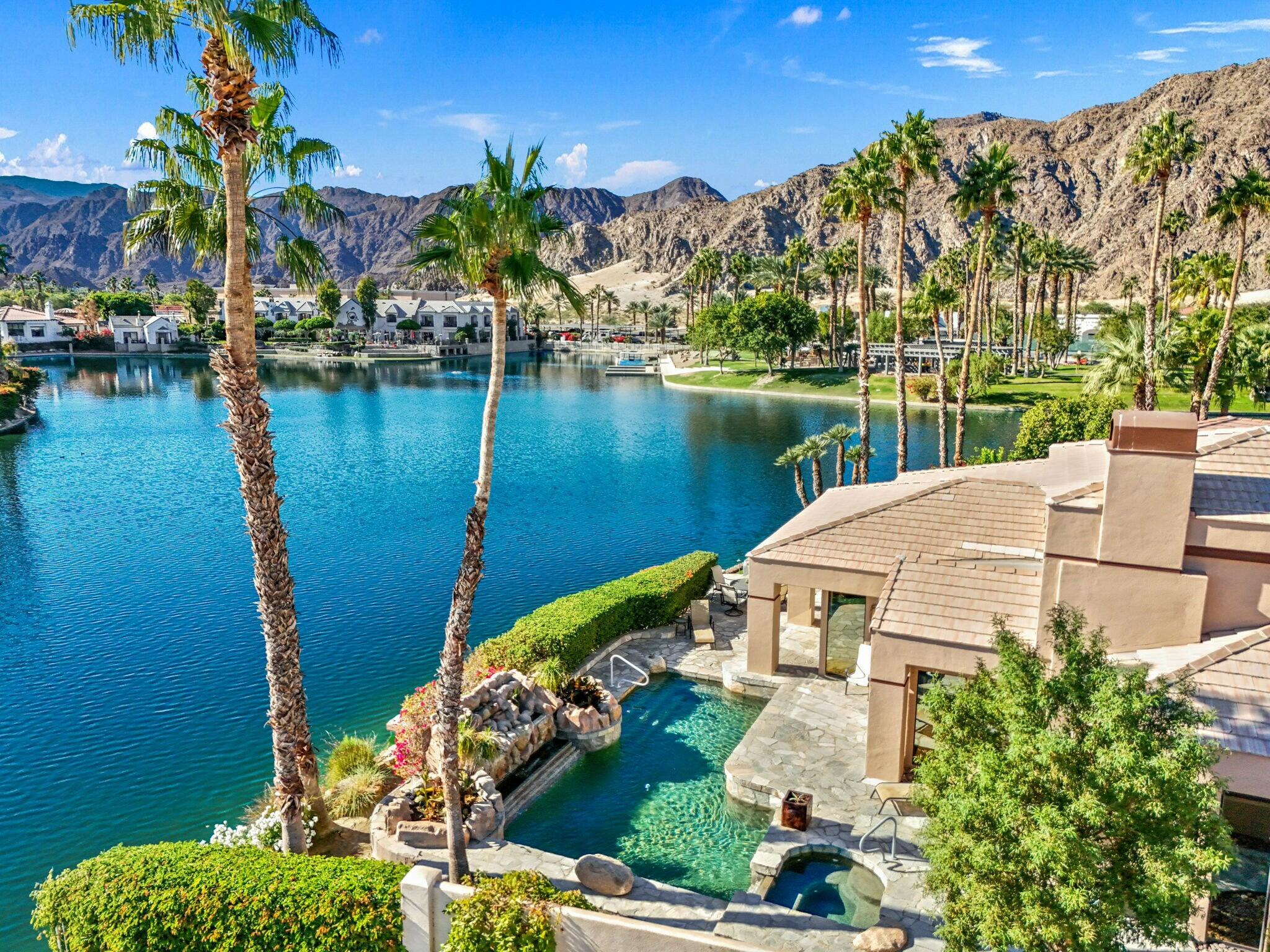 a view of a lake with a house in the background