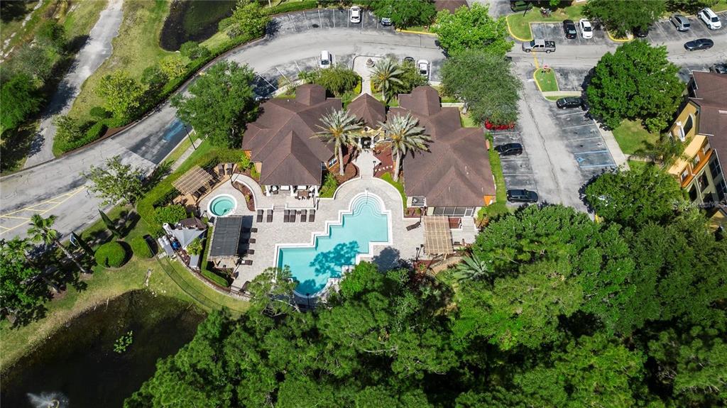 an aerial view of residential house with outdoor space and swimming pool