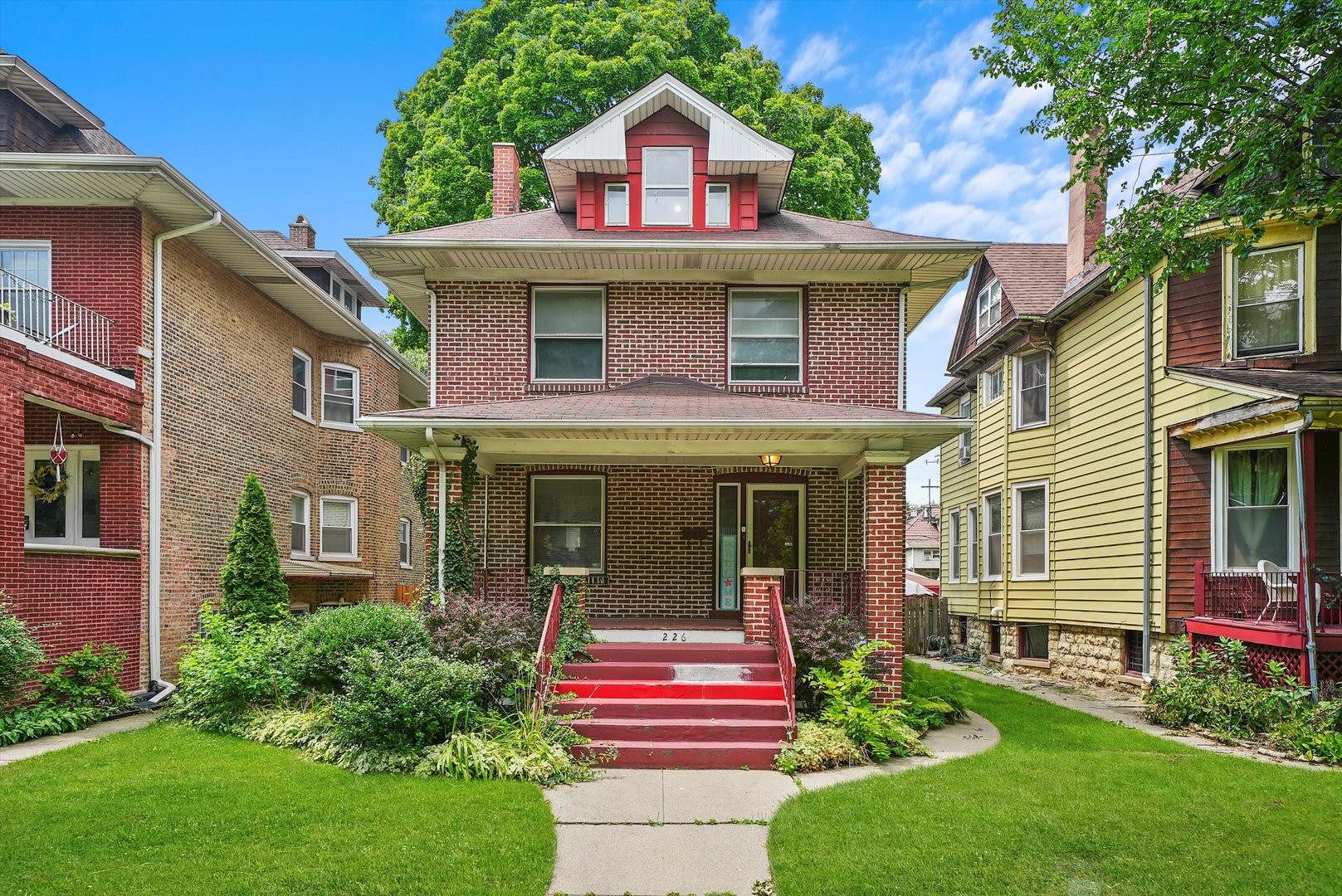 a front view of a house with a yard