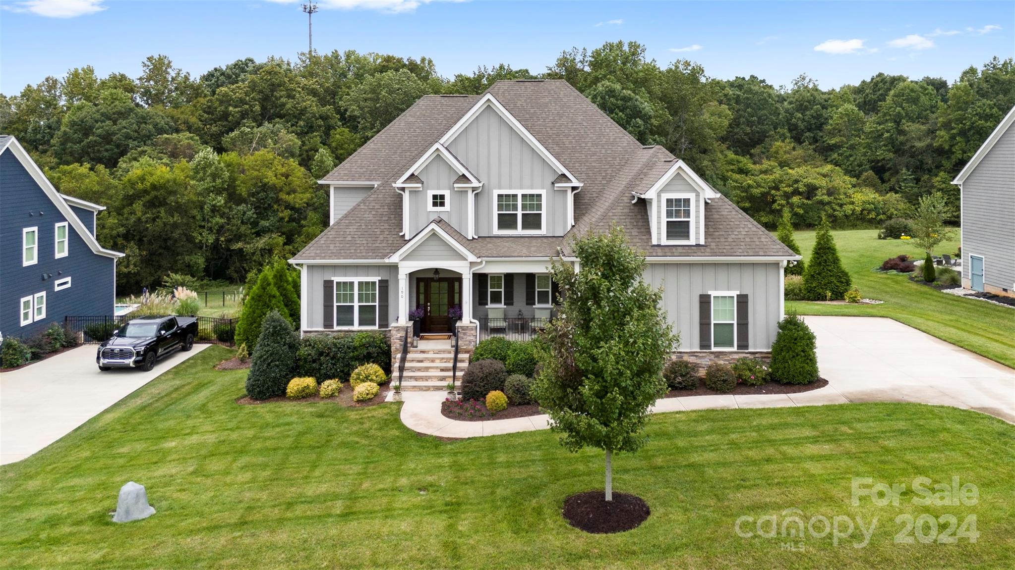 a front view of a house with garden