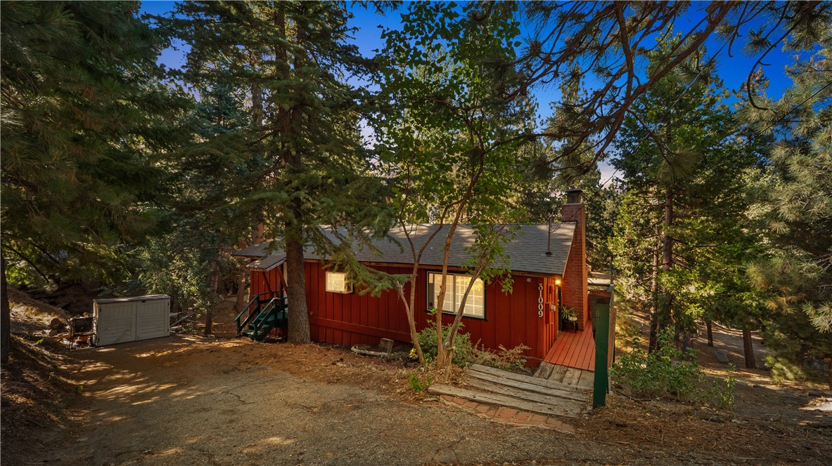 a view of a house with a tree