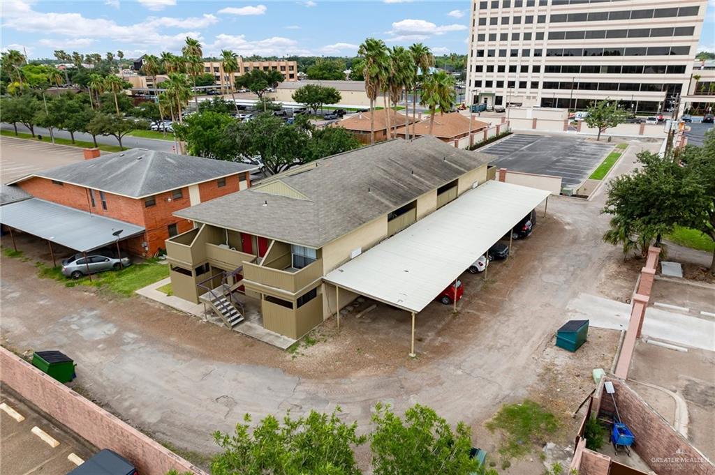 an aerial view of a house with garden space and street view