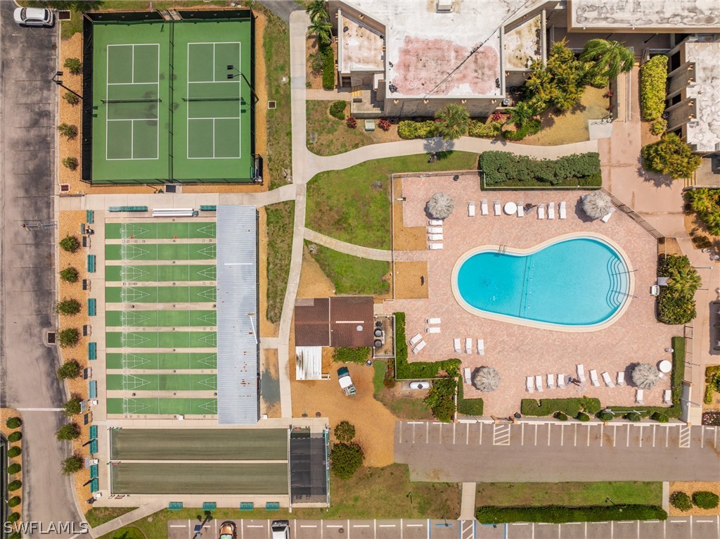 a view of a brick building with a swimming pool