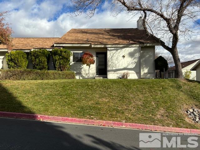 a view of a house with a yard