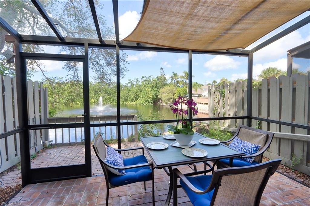 a dining room with furniture a rug and wooden floor