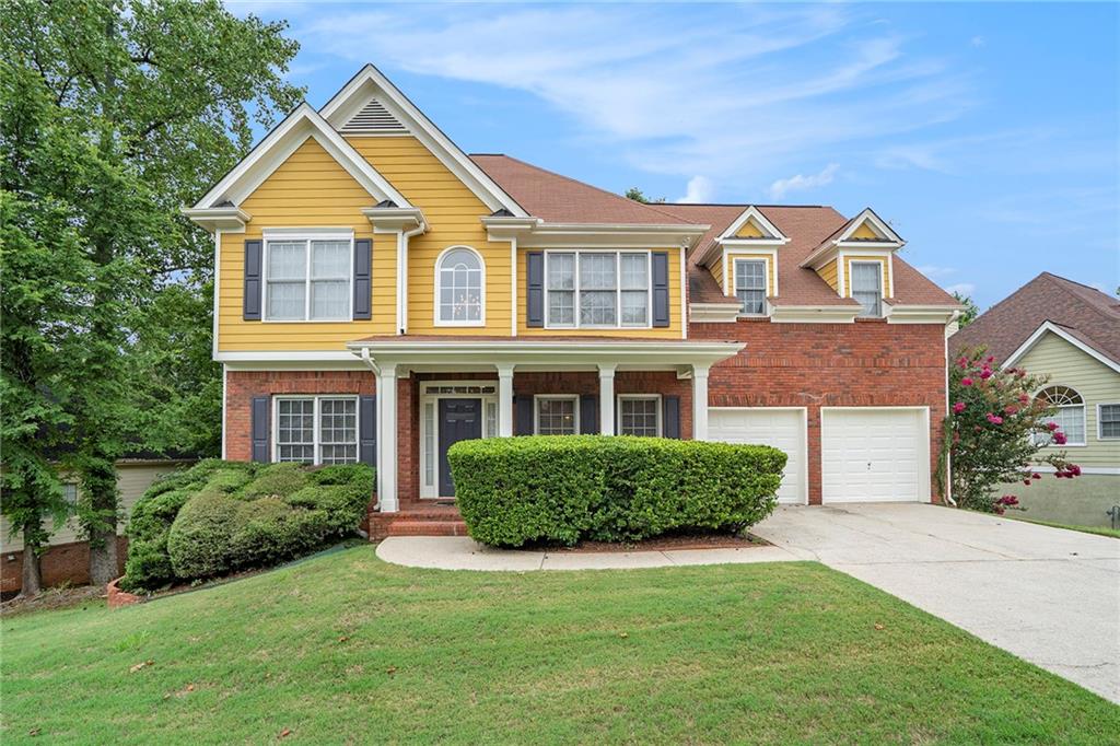 a front view of a house with a yard