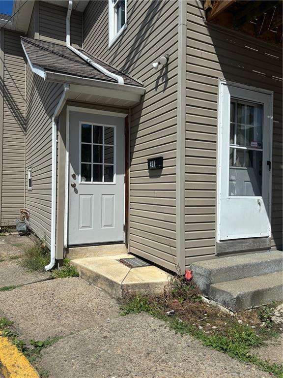 a view of house with garage