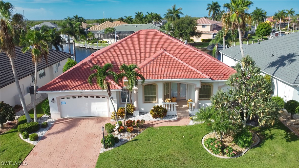 a front view of a house with garden