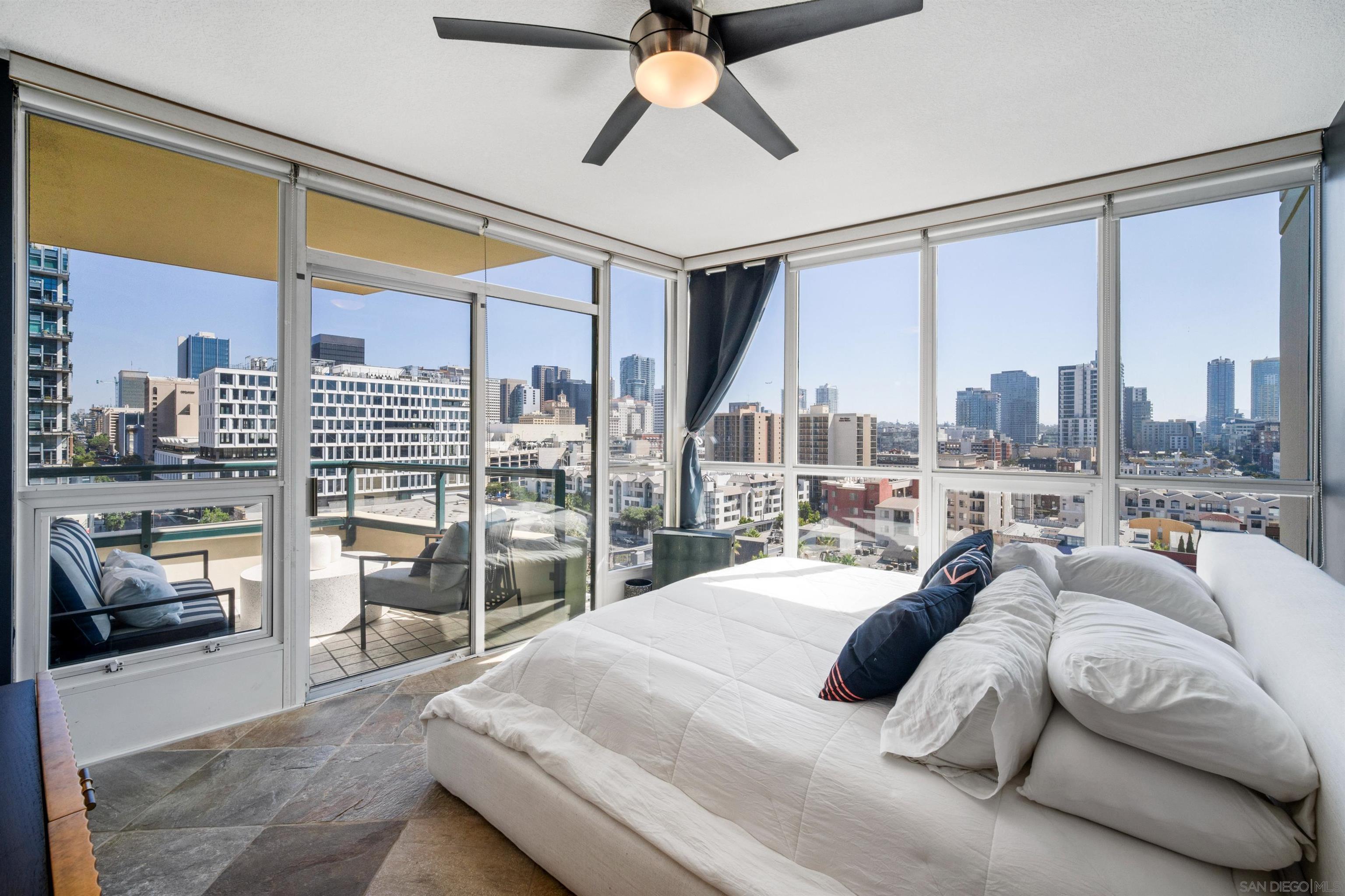 a bedroom with a large bed and a large window