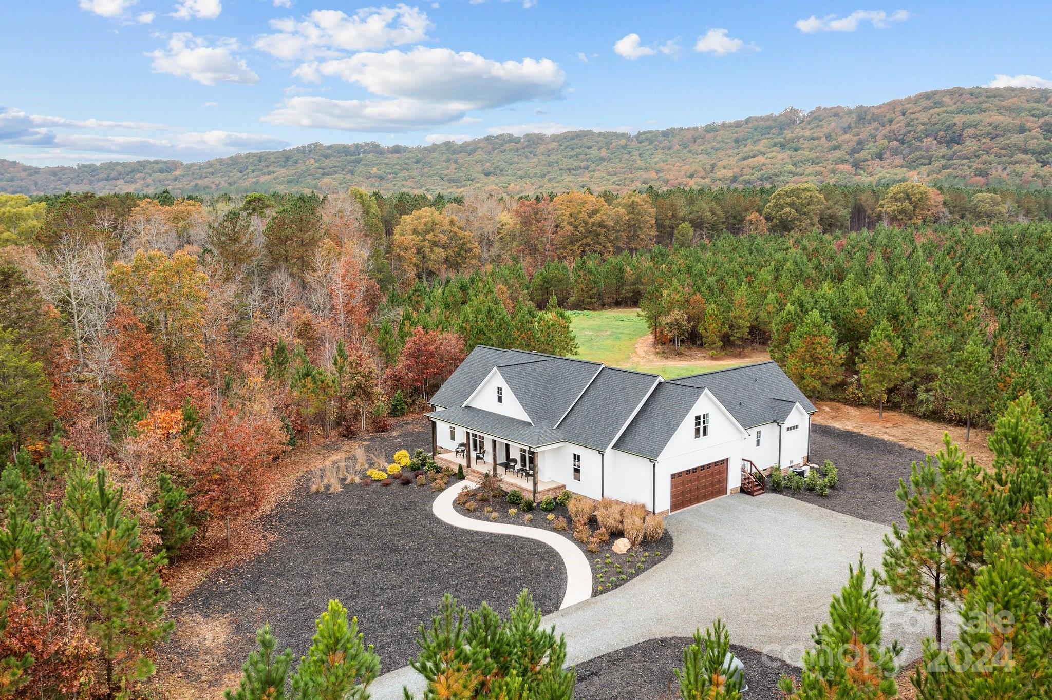 an aerial view of a house with a garden