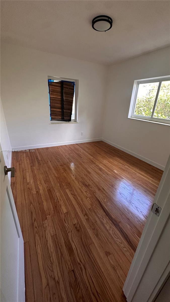 a view of an empty room and window