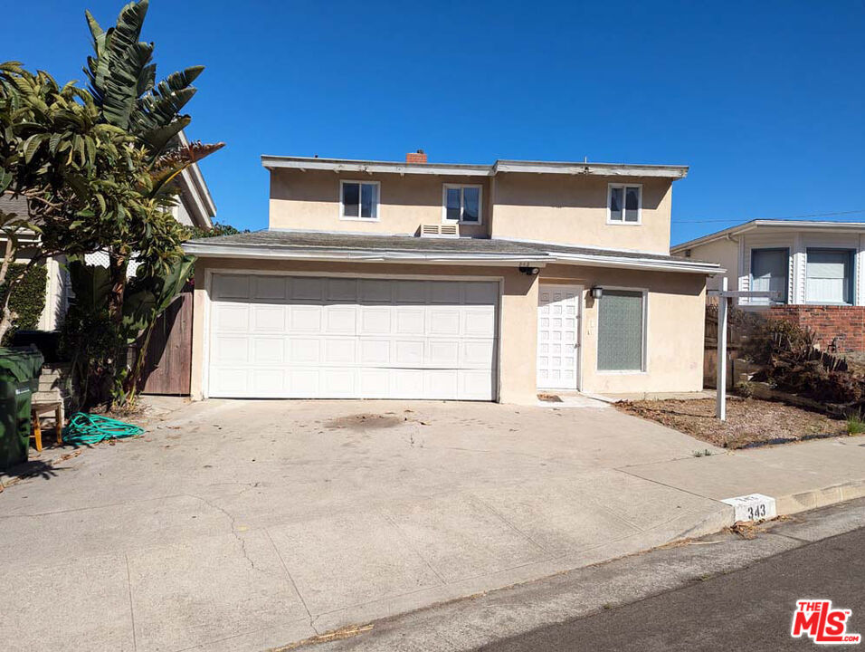 a view of a house with a outdoor space and street view