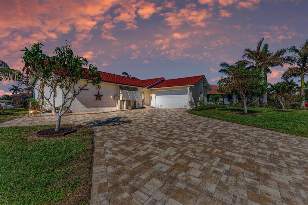 a house with palm tree in front of it