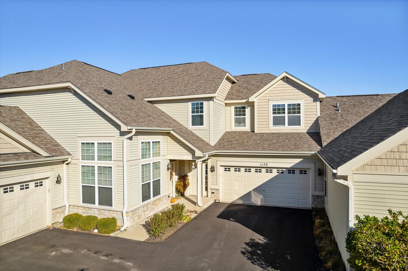 a front view of a house with a yard