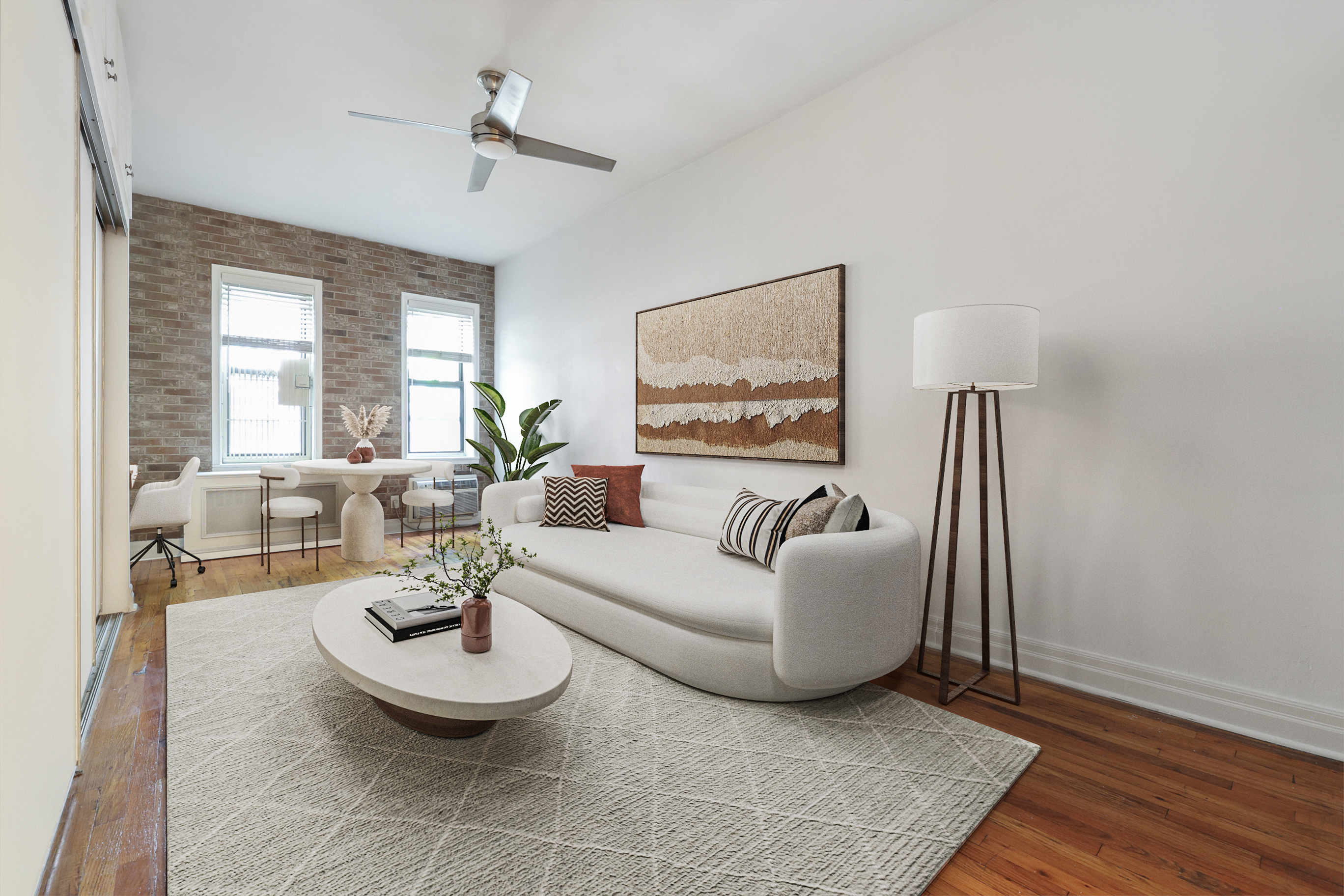 a living room with furniture a window and a table