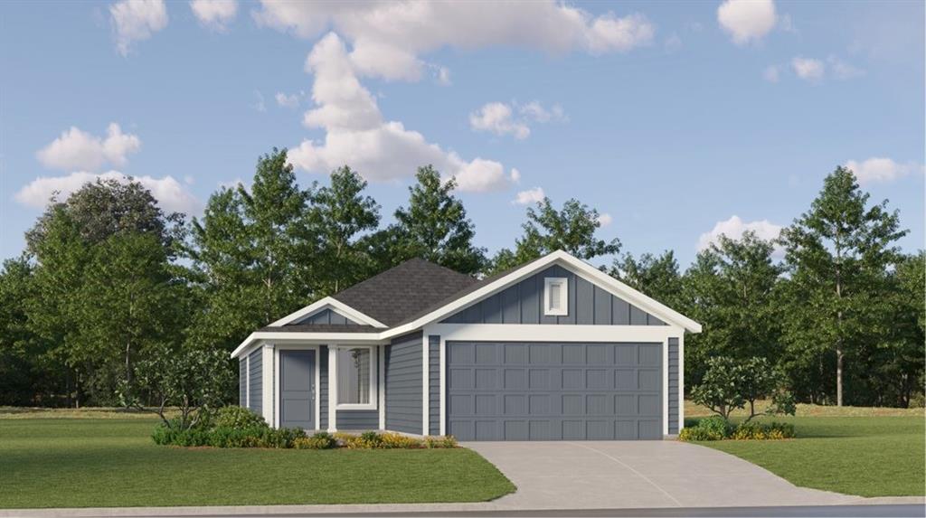 a front view of a house with a yard and trees