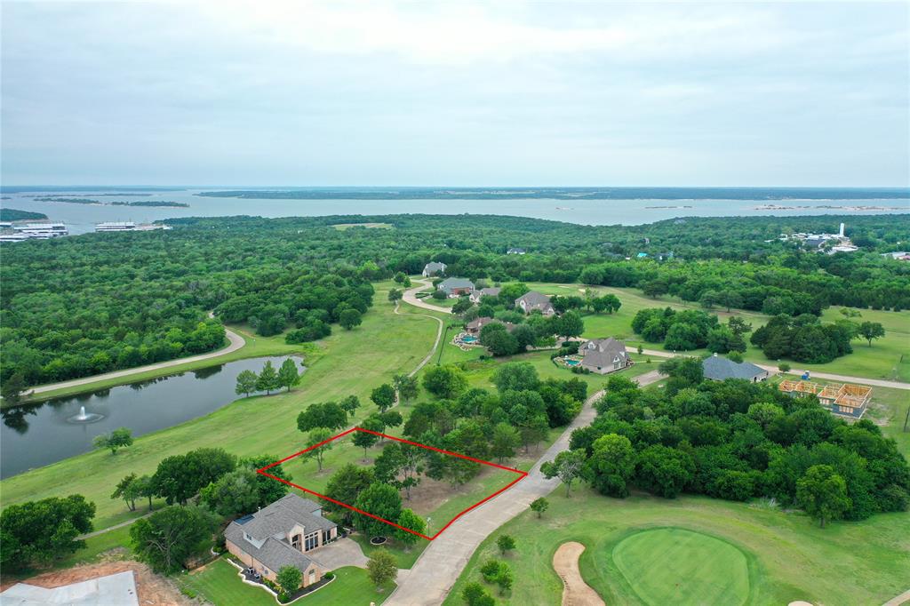 a view of a city with lush green forest