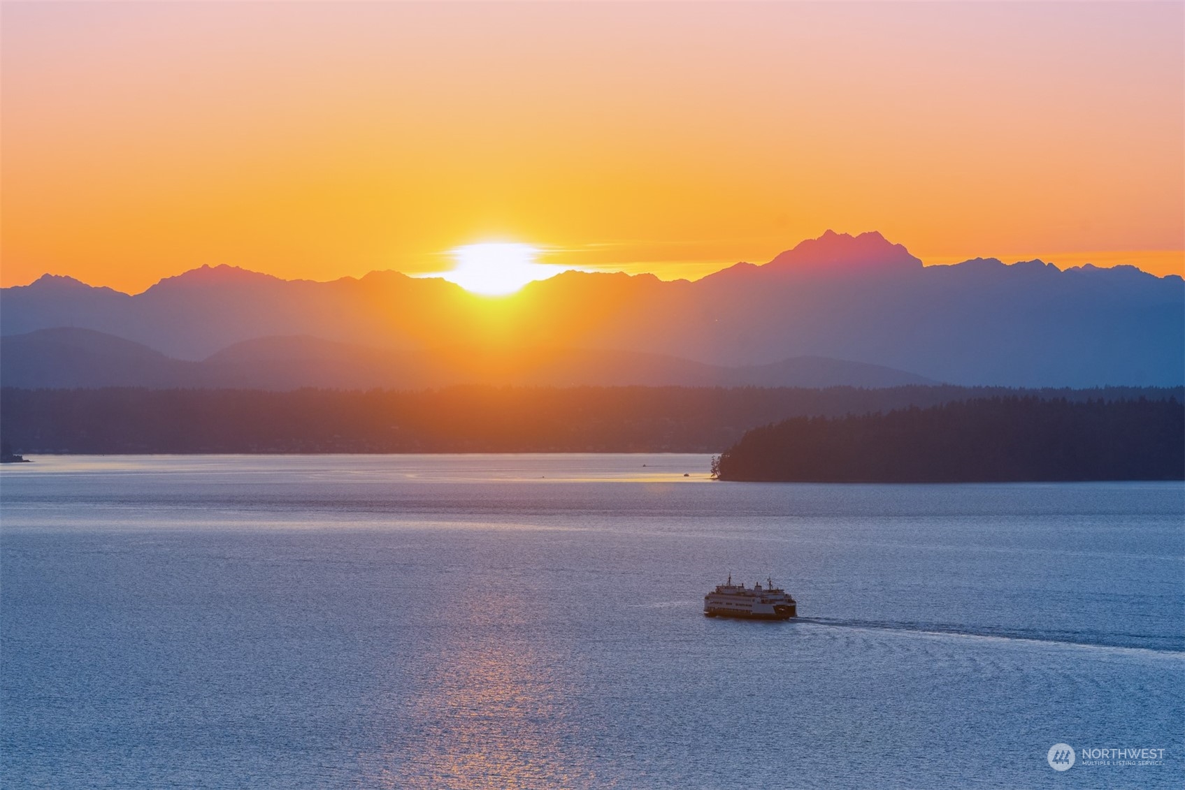 a view of ocean and mountains