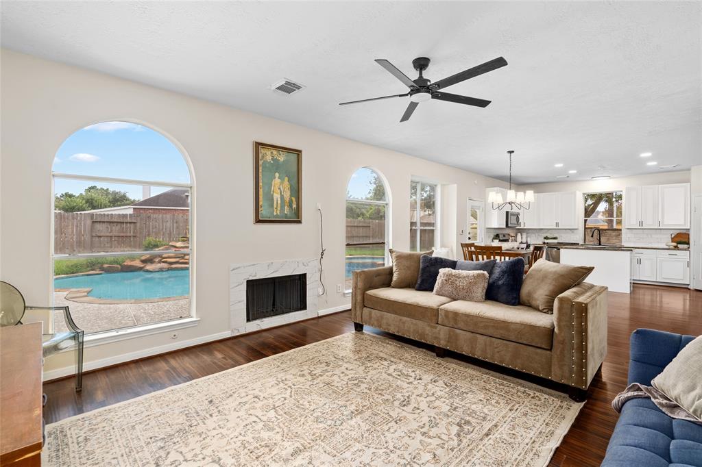 a living room with furniture and a fireplace