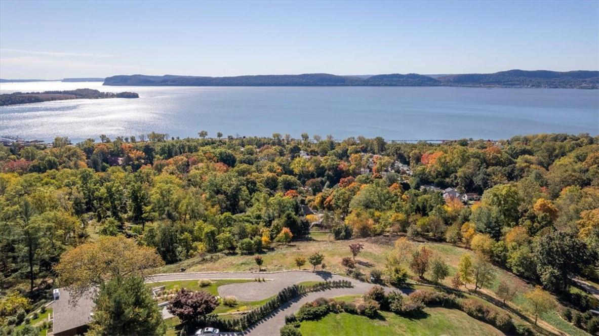 Bird's eye view with a water and mountain view