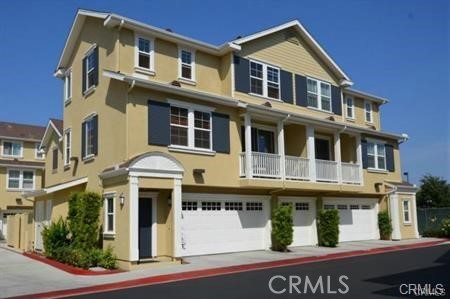 a front view of a residential apartment building with a yard