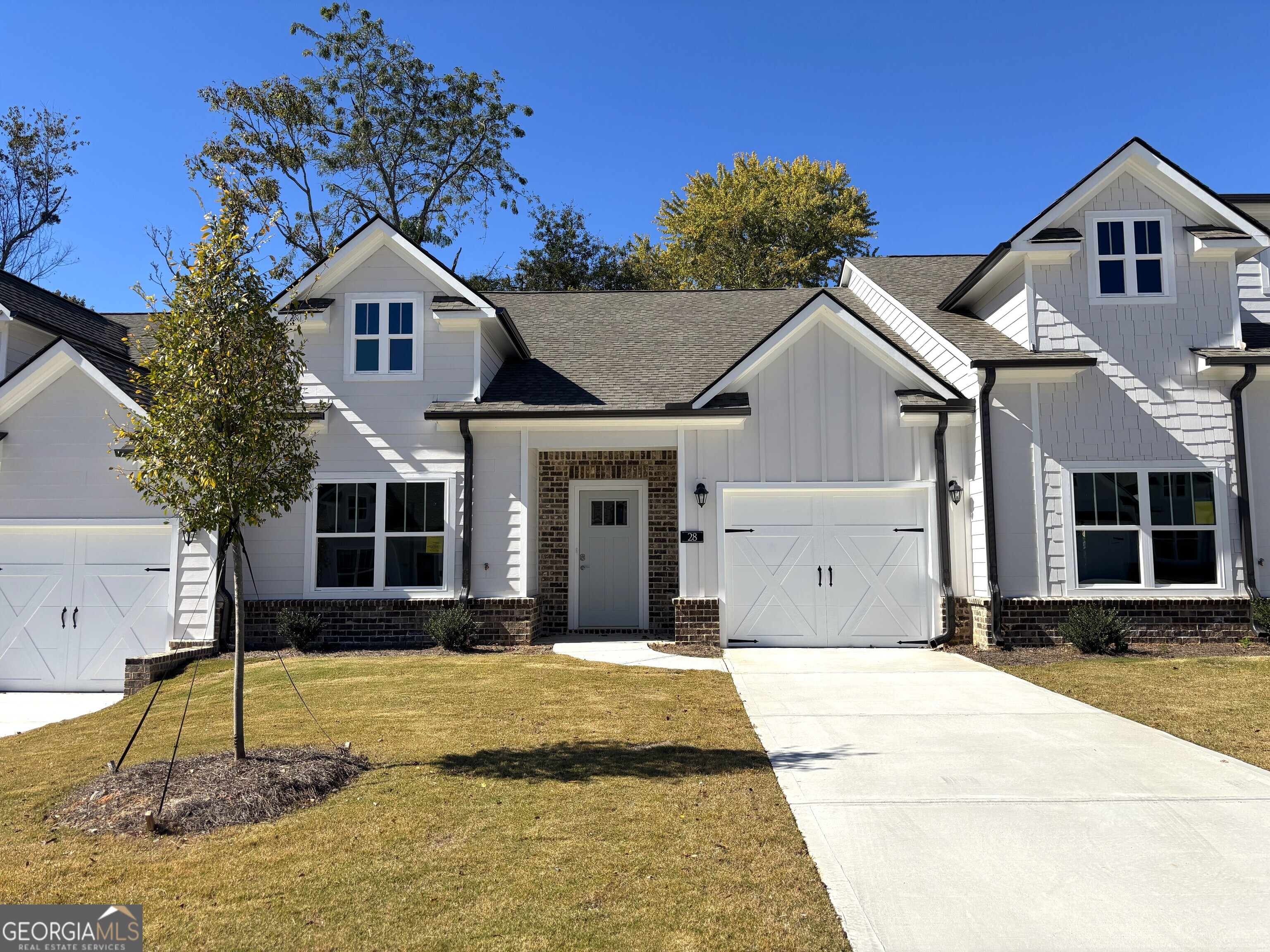 a front view of a house with a yard