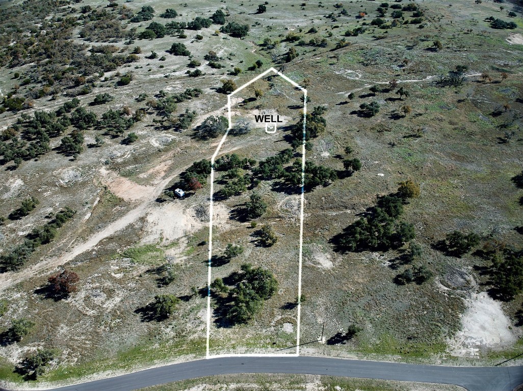 a aerial view of a house with a yard