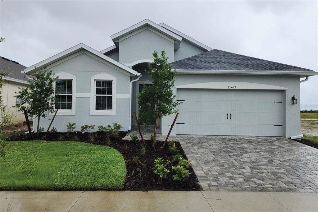 a front view of house with garden