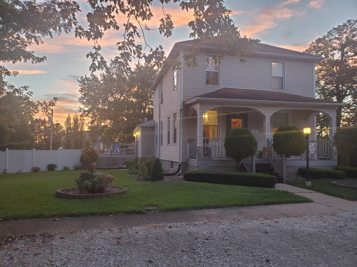 a view of a brick house with a yard