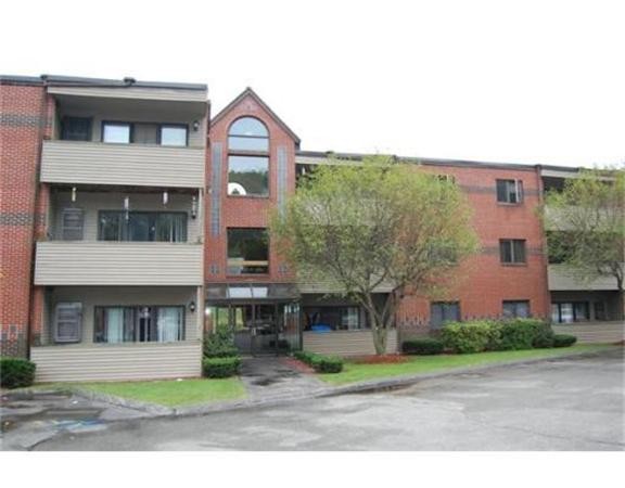 a front view of a building with garden