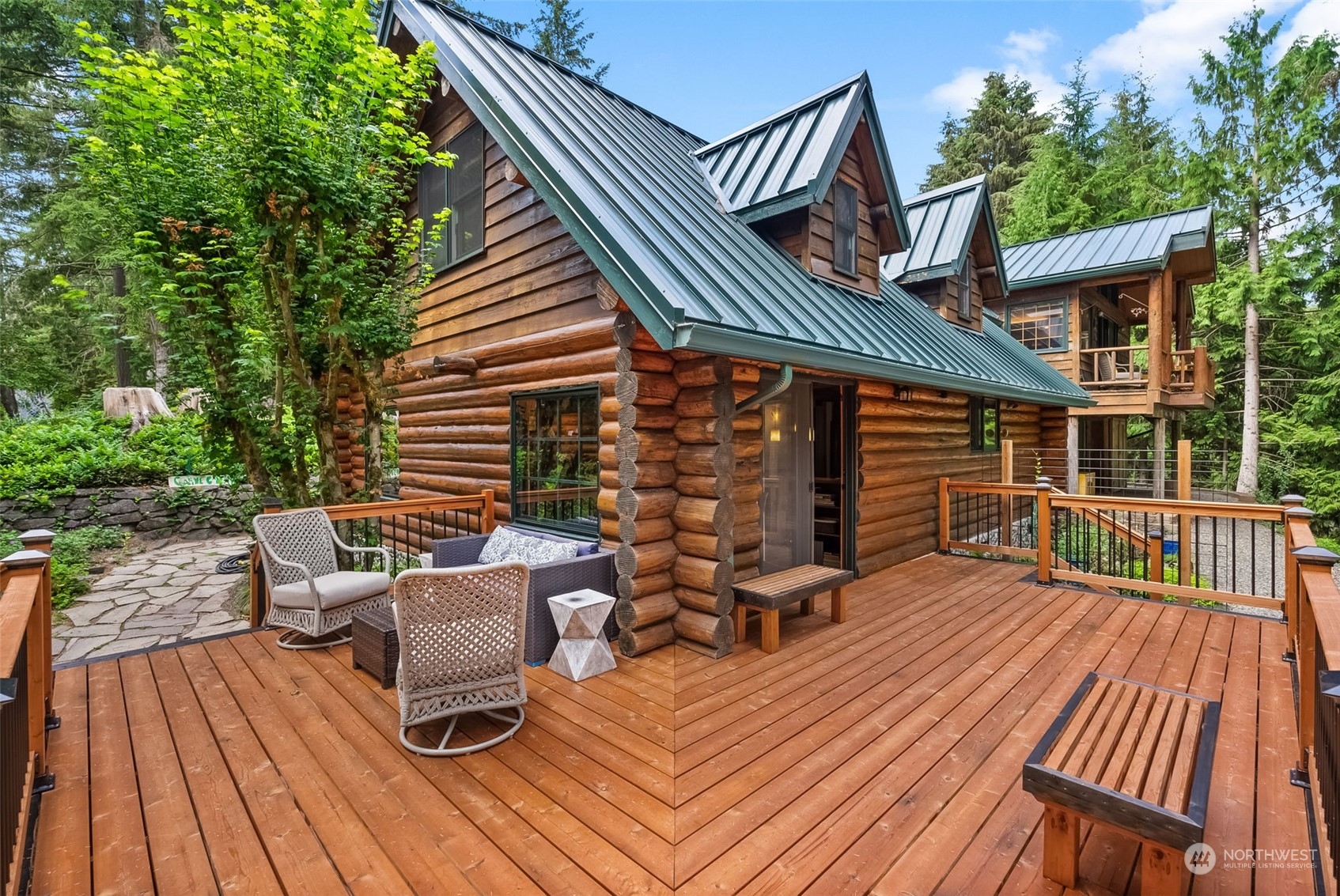 a view of a roof deck with wooden floor and fence