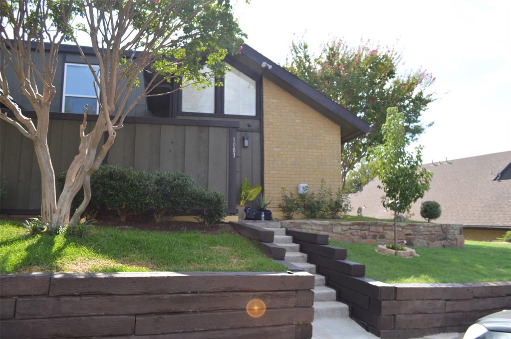 a backyard of a house with outdoor seating