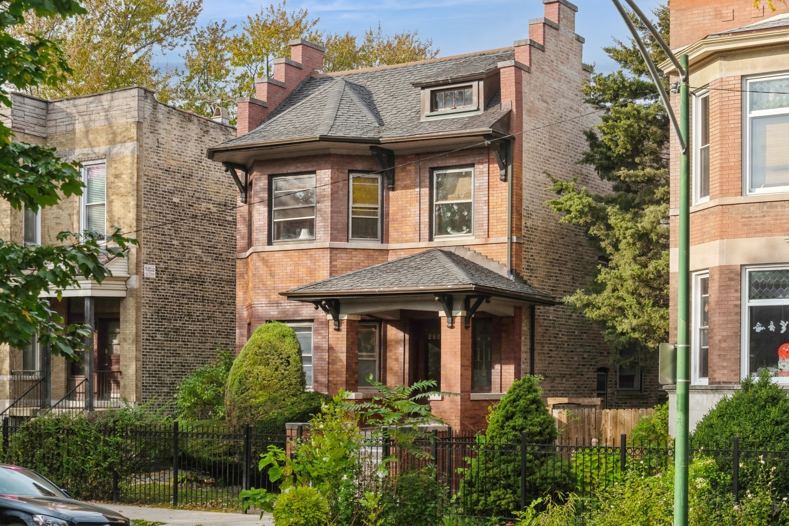 a front view of a house with garden