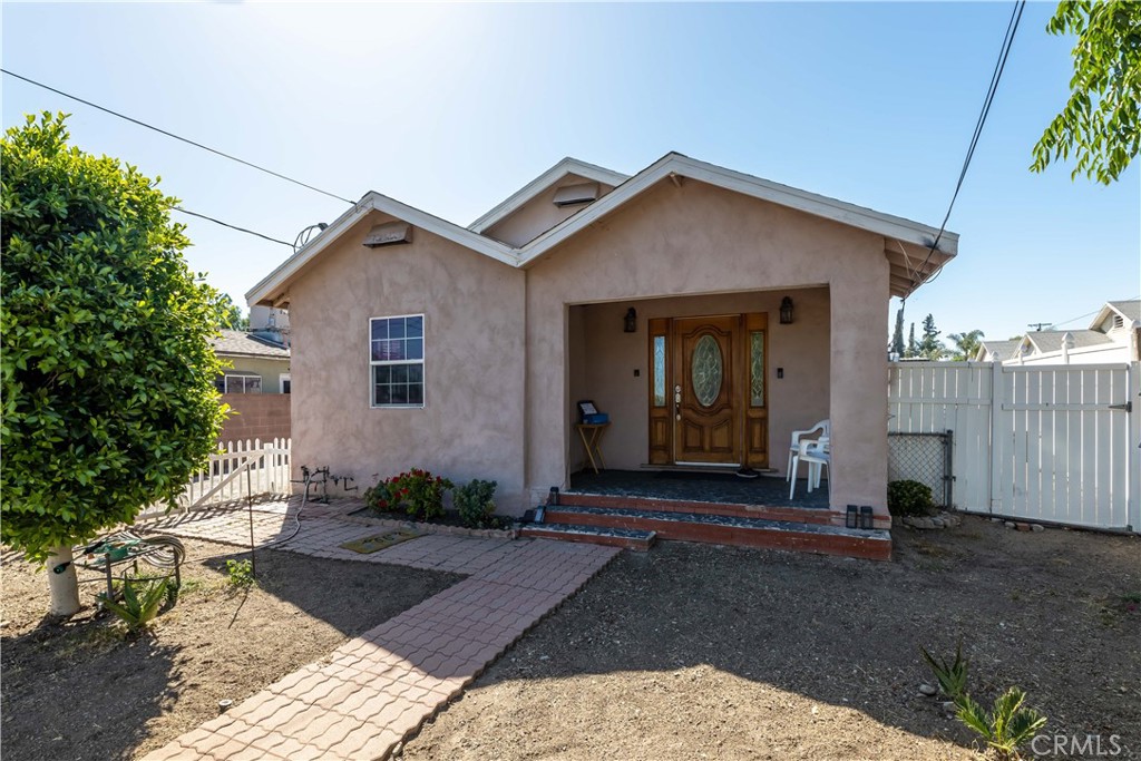 a view of a front of a house with a yard