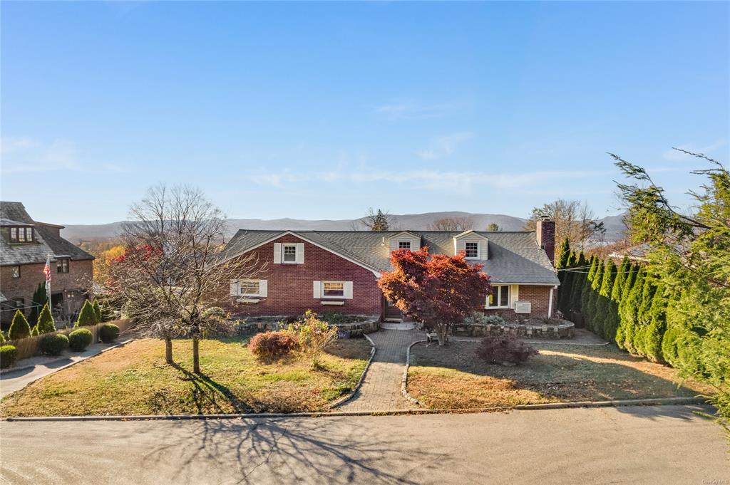 View of front of property with a front yard