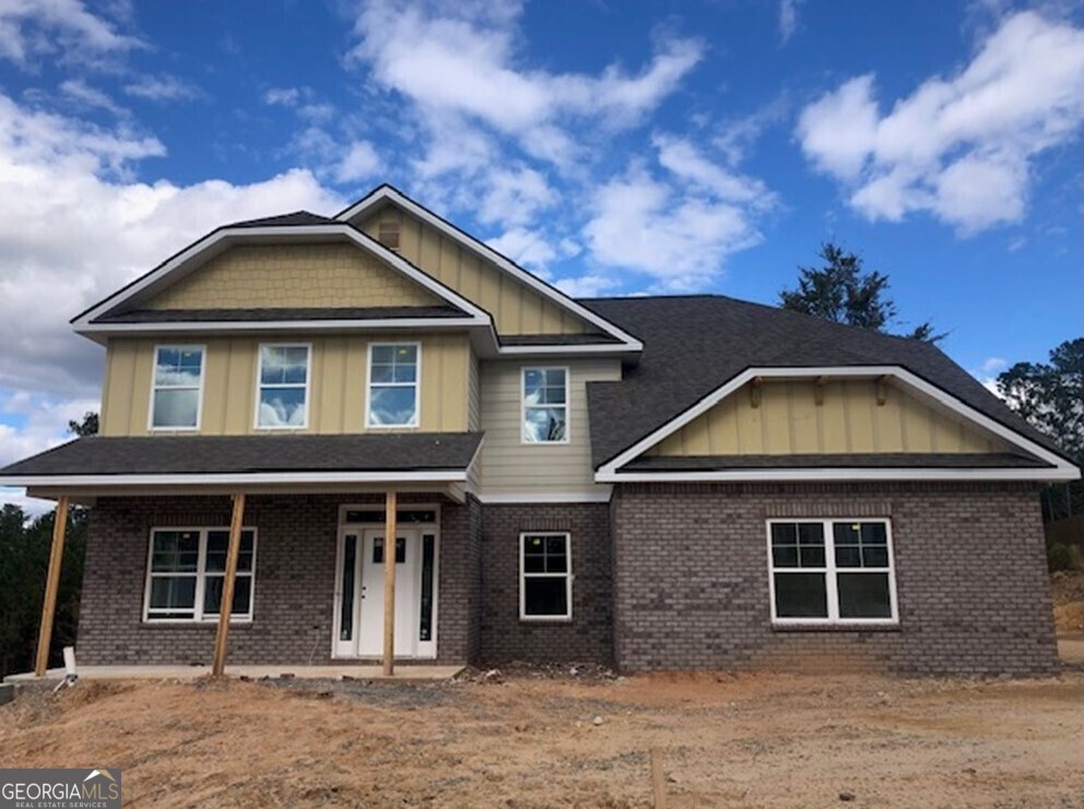 a front view of a house with yard