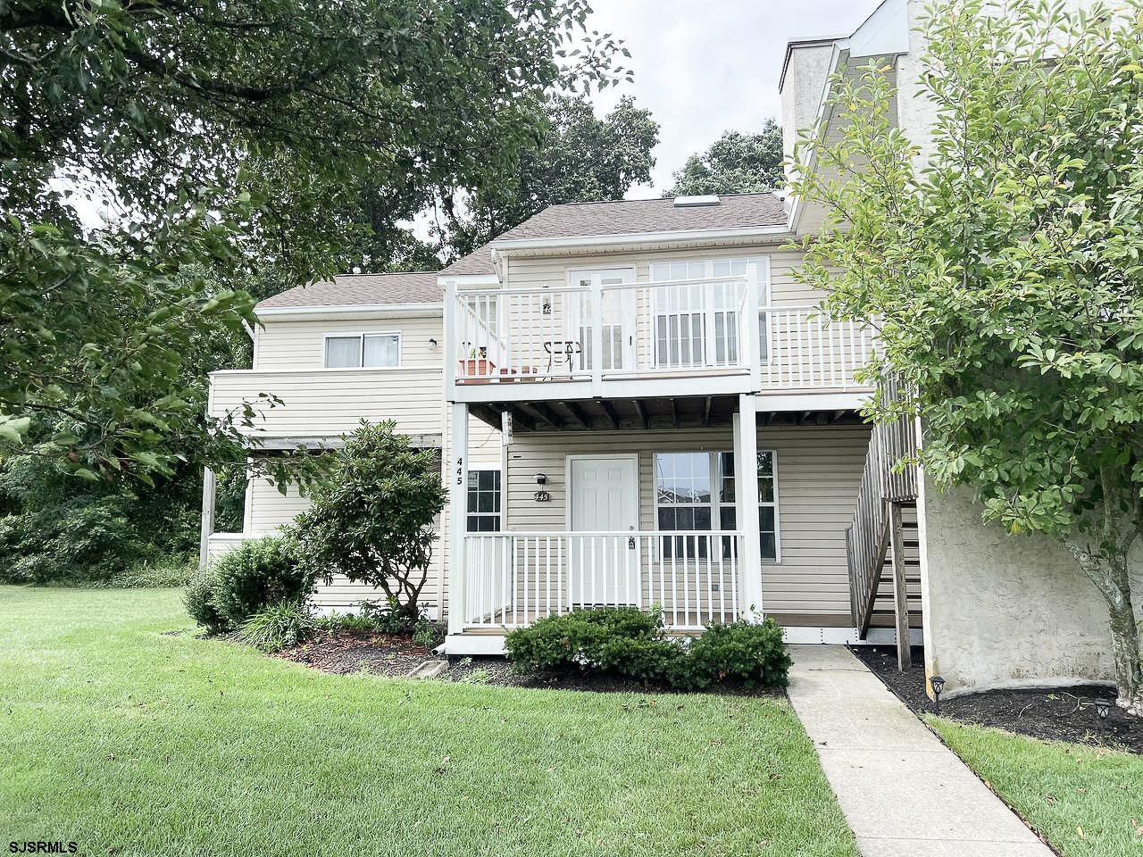 a view of front of house with a yard