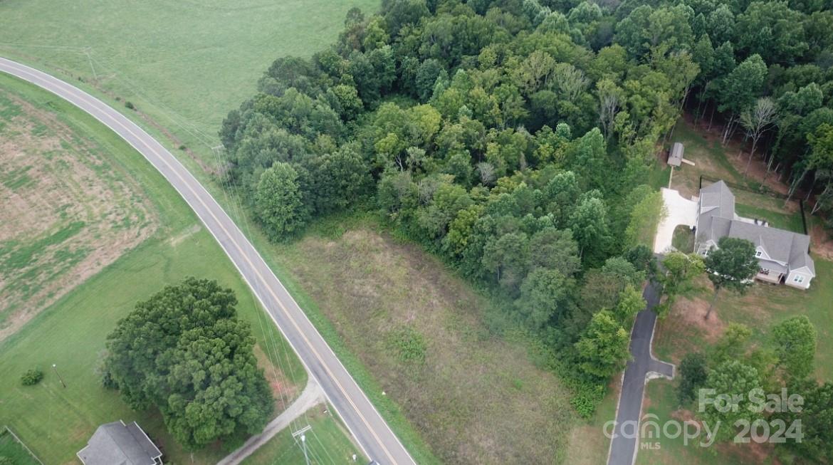 a view of a forest from a balcony