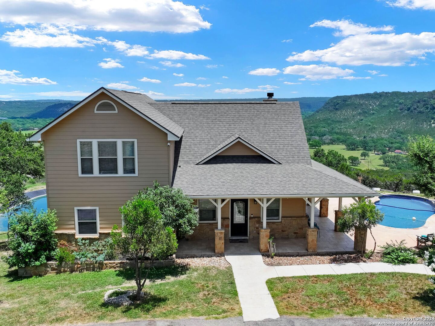 a front view of a house with a yard