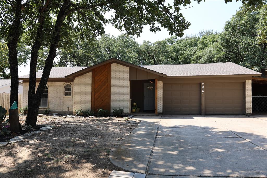 a house with trees in the background