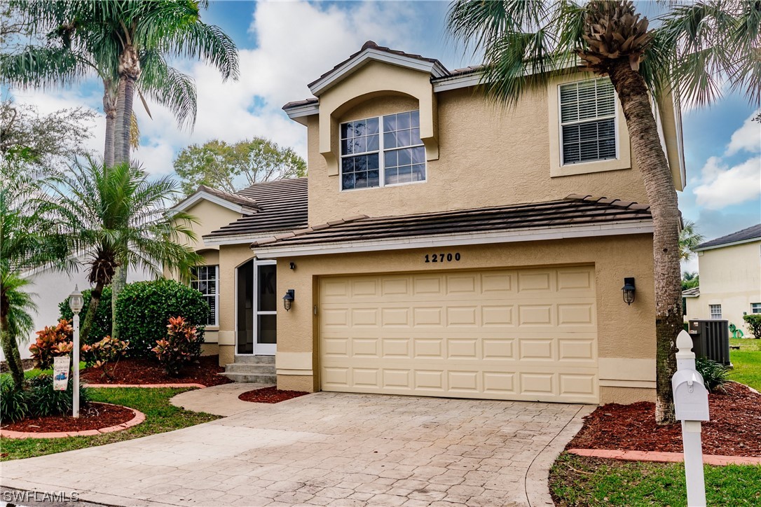 a front view of a house with garage